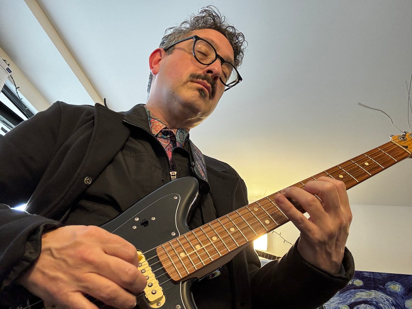 Steven Brent playing an electric guitar